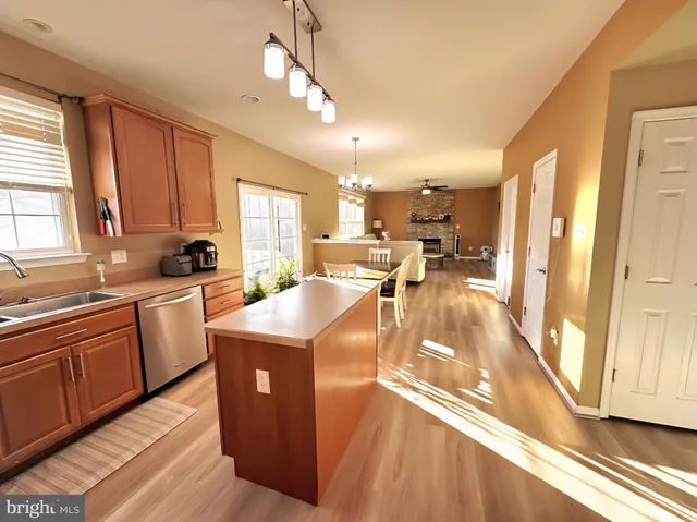 a kitchen with counter top space a sink and appliances