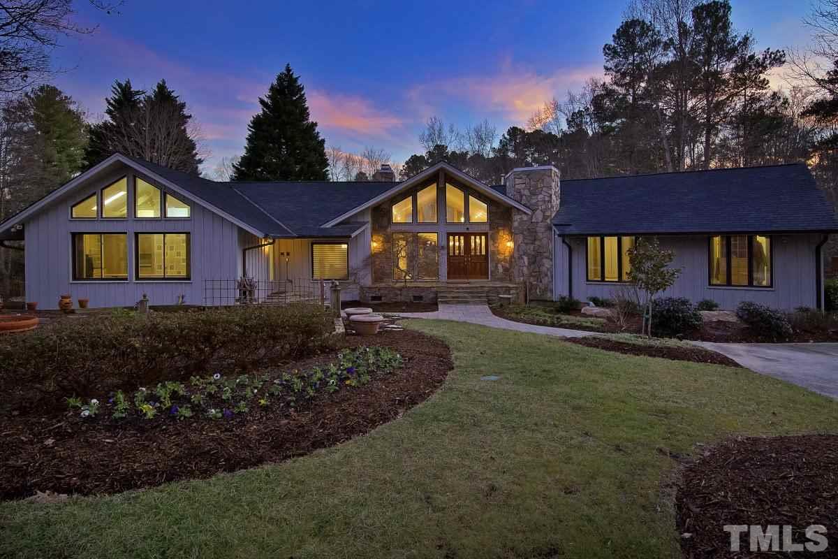 7209 Rainwater Road Raleigh, NC 27615 - Photo 1 of 25 a front view of a house with a yard and garage