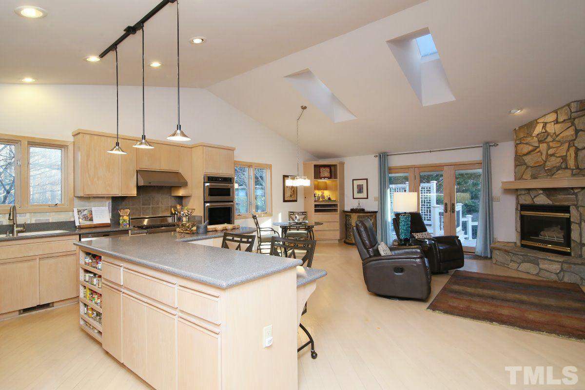 7209 Rainwater Road Raleigh, NC 27615 - Photo 11 of 25 a view of kitchen with kitchen island stainless steel appliances living room stove and living room
