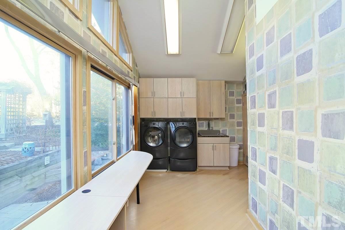 7209 Rainwater Road Raleigh, NC 27615 - Photo 12 of 25 a kitchen with a refrigerator and a stove