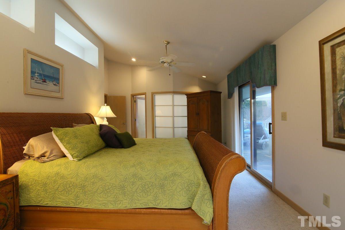 7209 Rainwater Road Raleigh, NC 27615 - Photo 13 of 25 a bed room with a bed and a painting