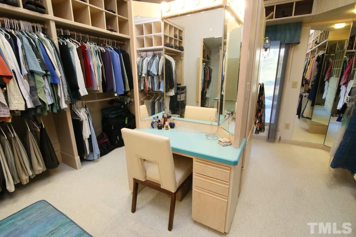 7209 Rainwater Road Raleigh, NC 27615 - Photo 17 of 25 a view of walk in closet with clothes and shoes