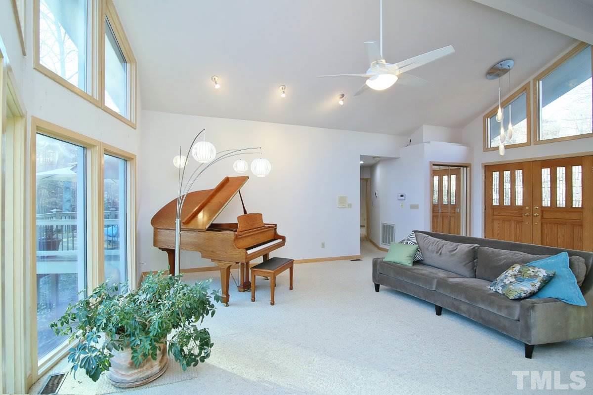 7209 Rainwater Road Raleigh, NC 27615 - Photo 6 of 25 a living room with furniture and a potted plant
