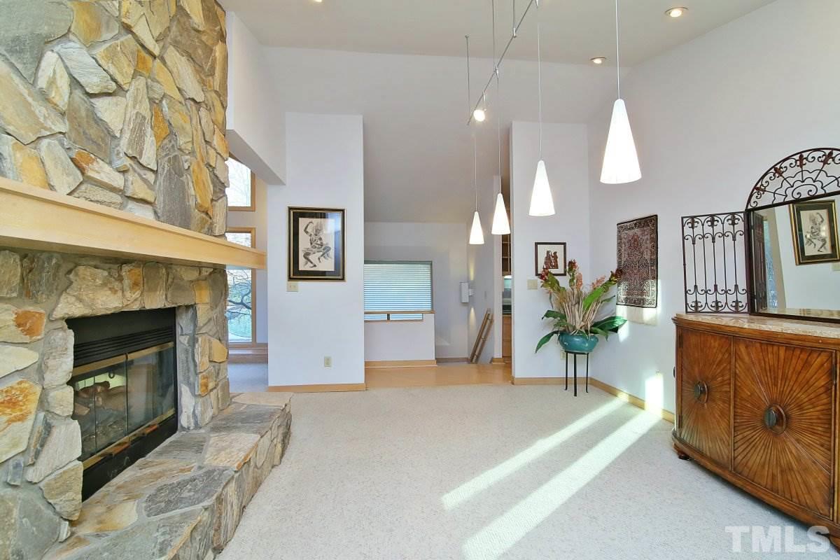 7209 Rainwater Road Raleigh, NC 27615 - Photo 7 of 25 a living room with furniture and a fireplace