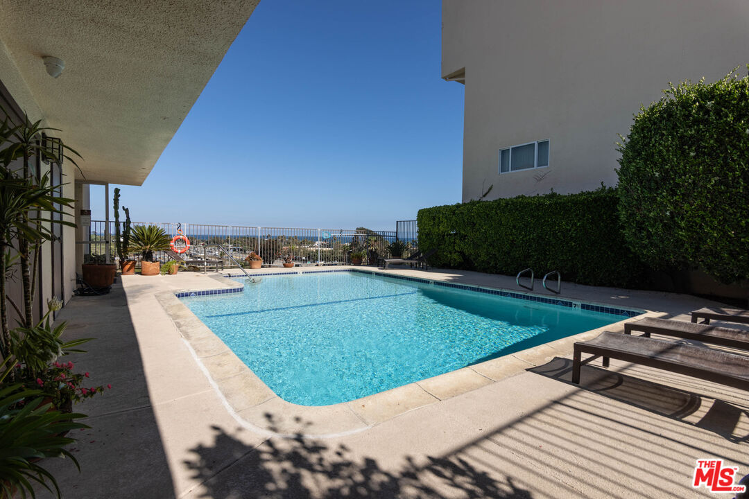 23901 Civic Center Way, Unit B137 Malibu, CA 90265 - Photo 13 of 27 a view of a swimming pool with a patio