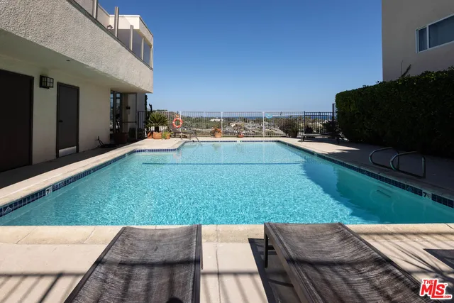 a view of backyard with seating area