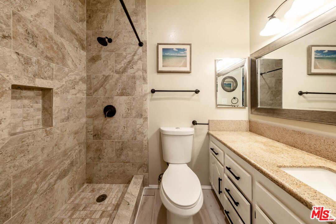 23901 Civic Center Way, Unit B137 Malibu, CA 90265 - Photo 9 of 27 a white toilet sitting next to a bath tub