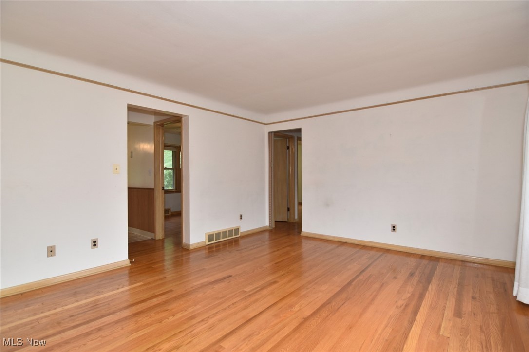 9421 David Road Cleveland, OH 44125 - Photo 5 of 36 Empty room featuring light wood-style floors