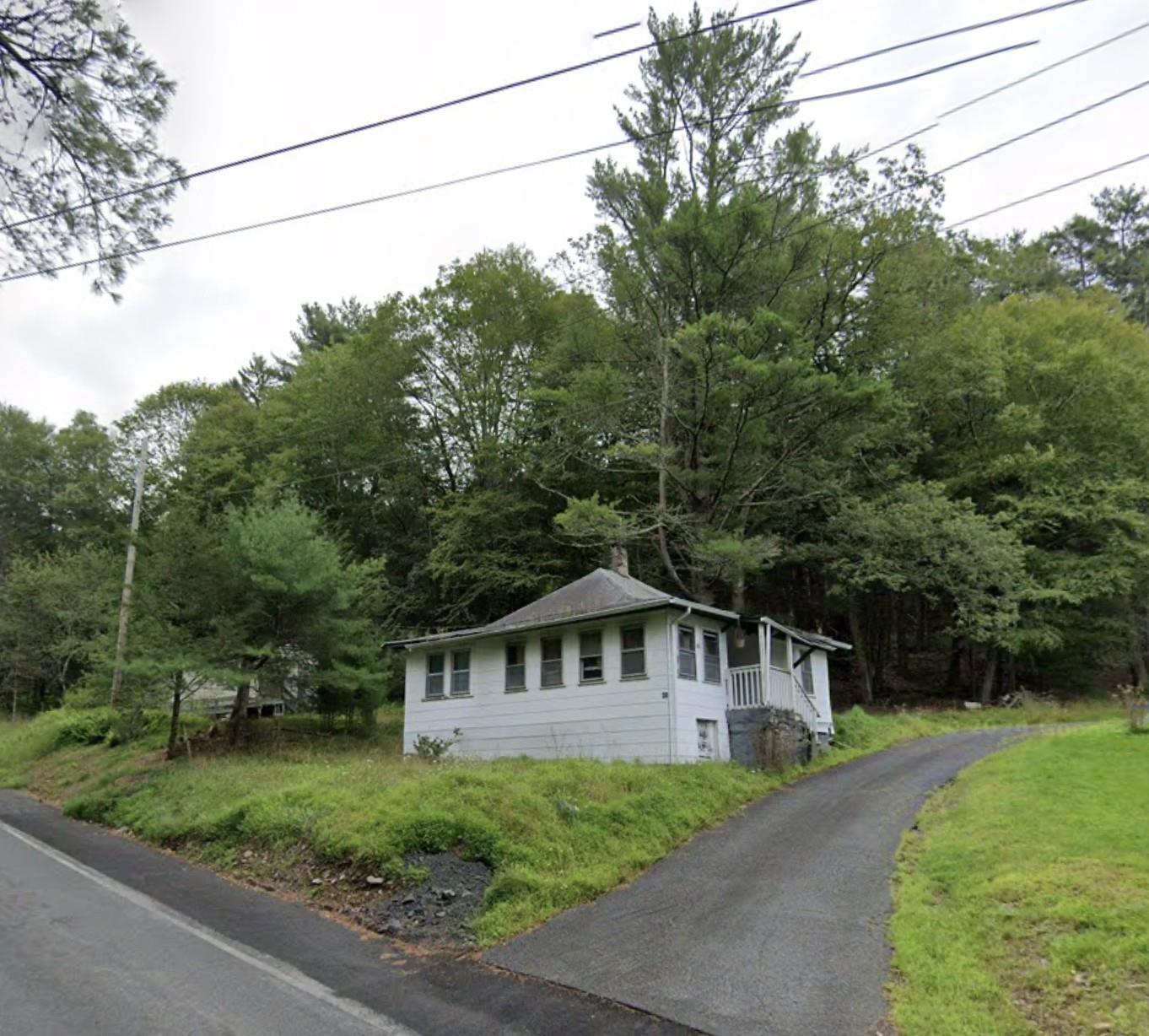 View of home's exterior with a chimney