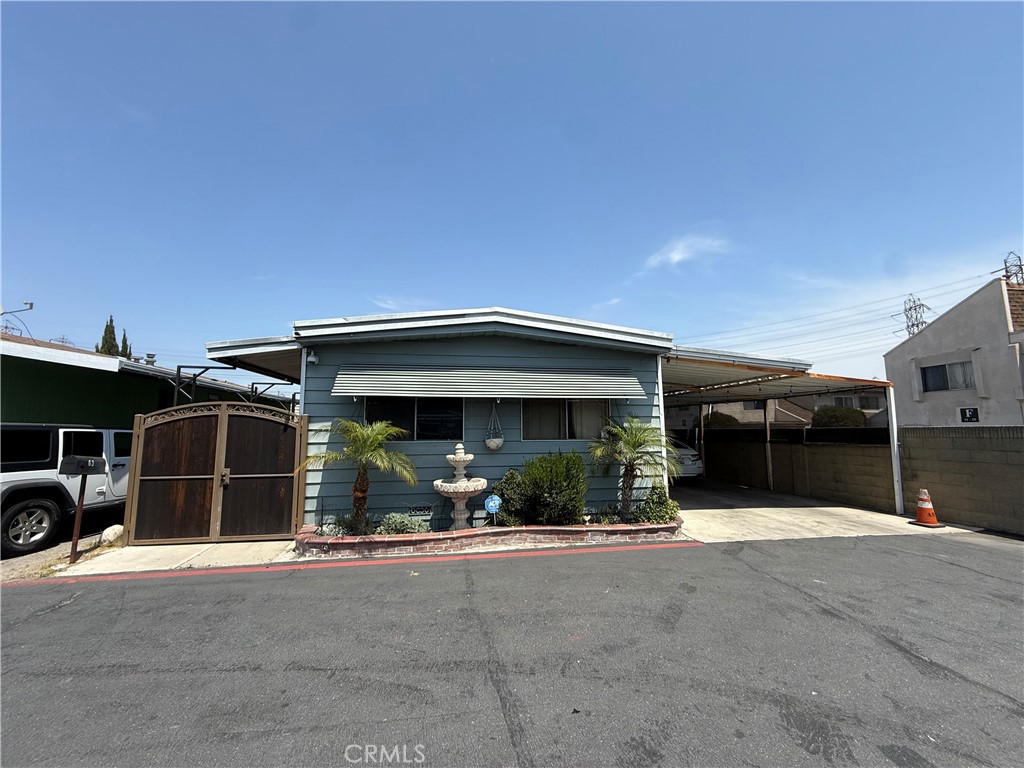 16600 Orange Avenue, Unit 63 Paramount, CA 90723 - Photo 1 of 12 a view of a car garage