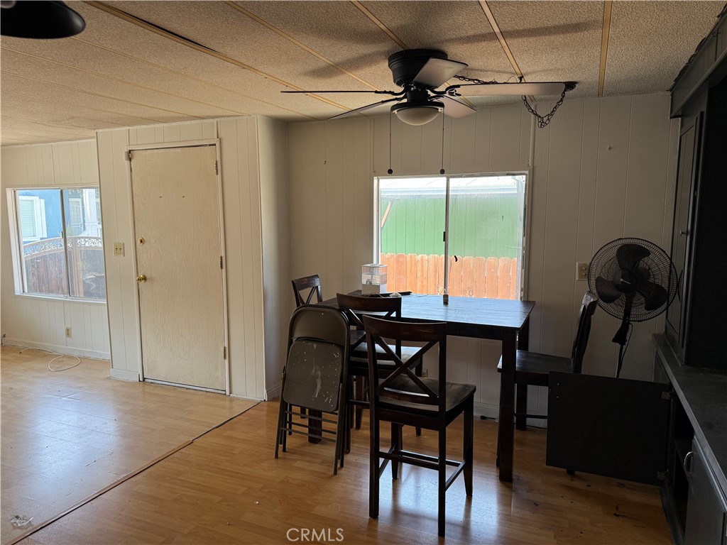 16600 Orange Avenue, Unit 63 Paramount, CA 90723 - Photo 3 of 12 a view of a dining room with furniture window and wooden floor