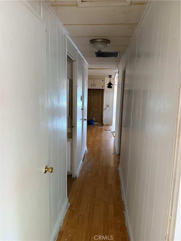 16600 Orange Avenue, Unit 63 Paramount, CA 90723 - Photo 7 of 12 a view of hallway with wooden floor