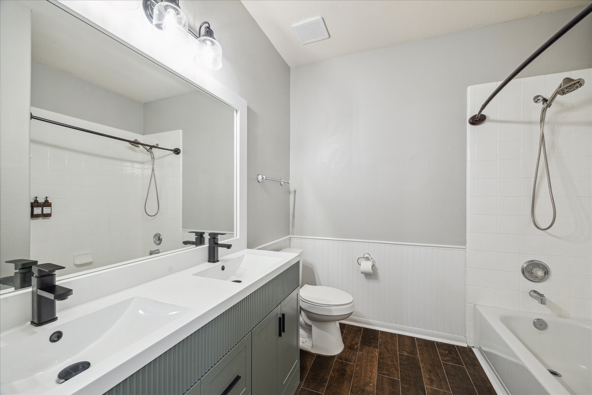 20910 Sandy Briar Court Spring, TX 77379 - Photo 26 of 28 a bathroom with a sink double vanity granite toilet and shower