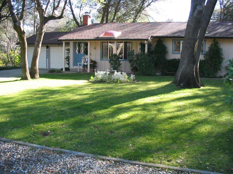 8590 Redbank Road Redding, CA 96001 - Photo 1 of 1 a front view of a house with a yard