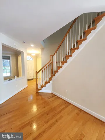 a view of an entryway with wooden floor