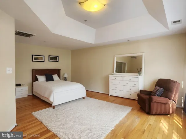 a bedroom with a bed and couch