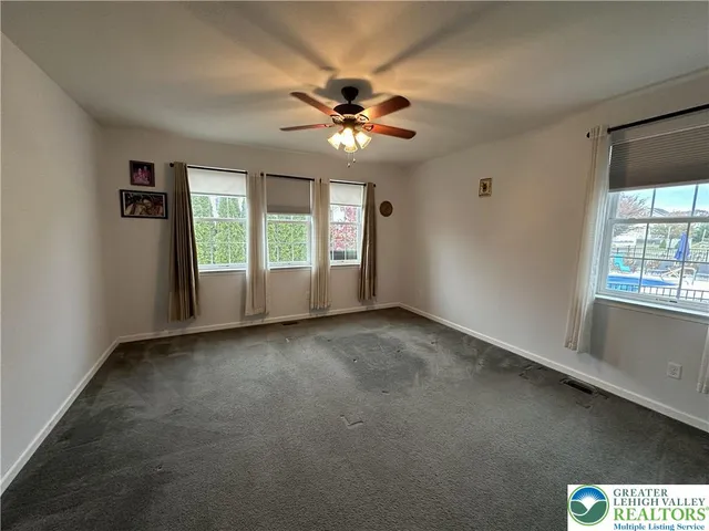 a large bathroom with a large tub and sink