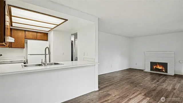 a kitchen with a sink and a large window