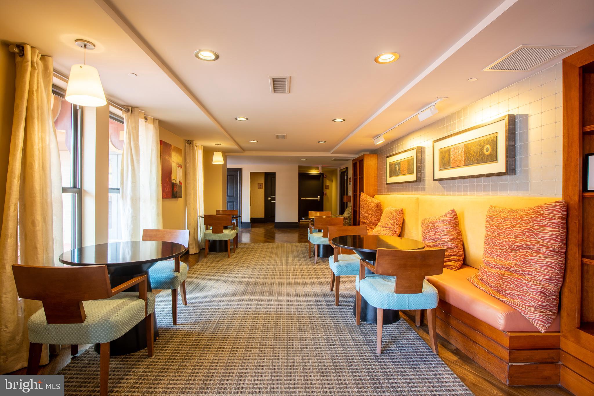777 7th Street Northwest, Unit 1017 Washington, DC 20001 - Photo 9 of 13 a living room with furniture and a table
