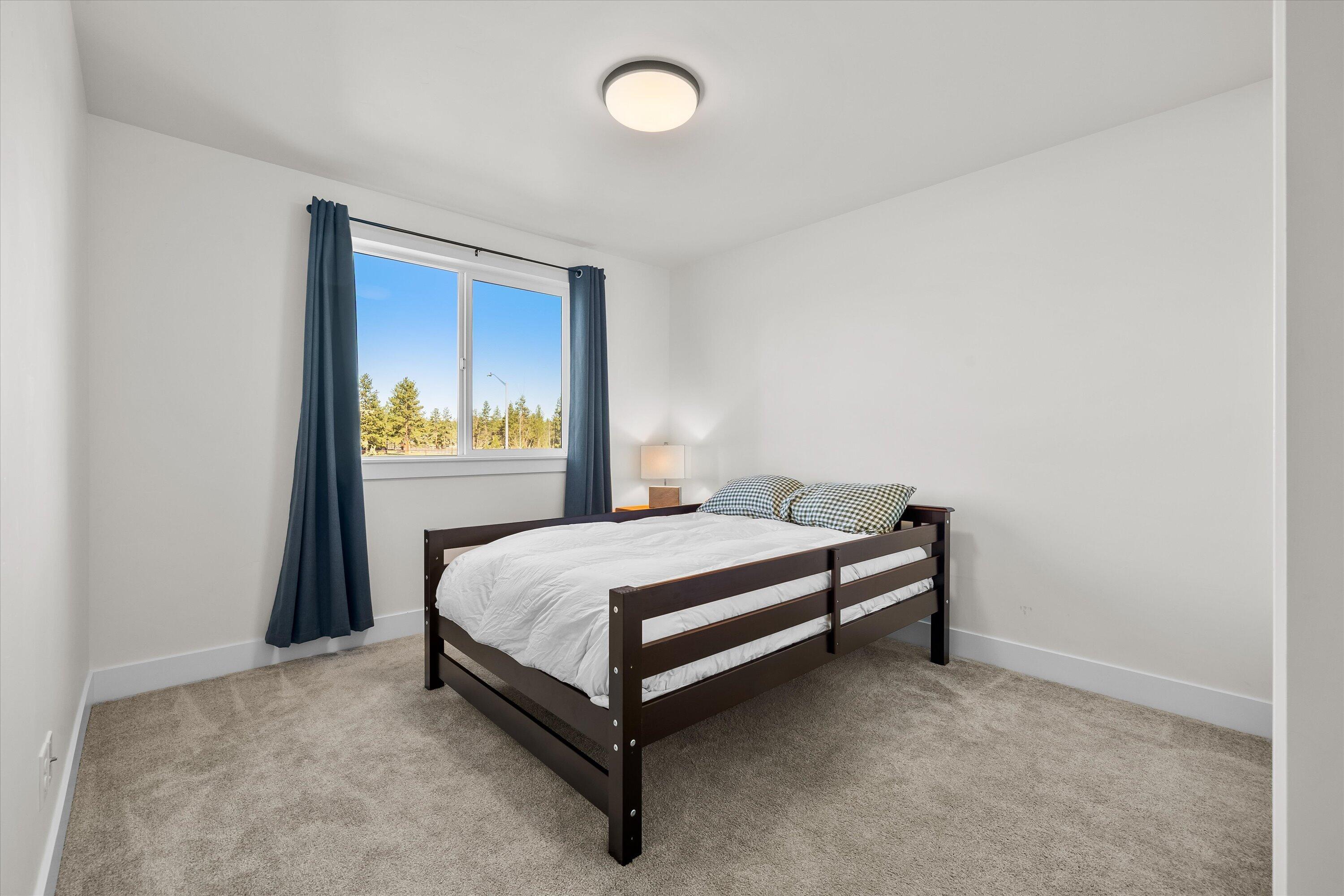 60903 Southeast Epic Place Bend, OR 97702 - Photo 29 of 48 a bedroom with a bed and window