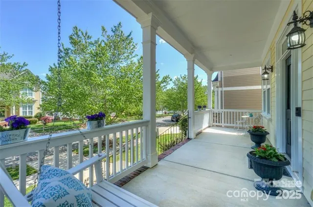a view of a porch with a bench in balcony