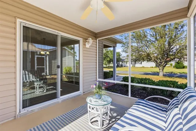 a view of a patio with a dining table and chairs