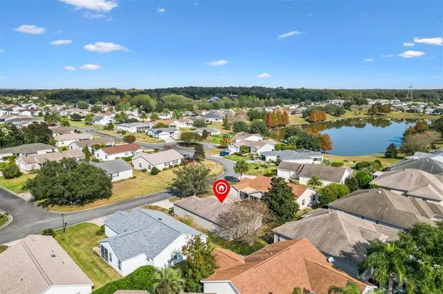 an aerial view of residential building with outdoor space and lake view