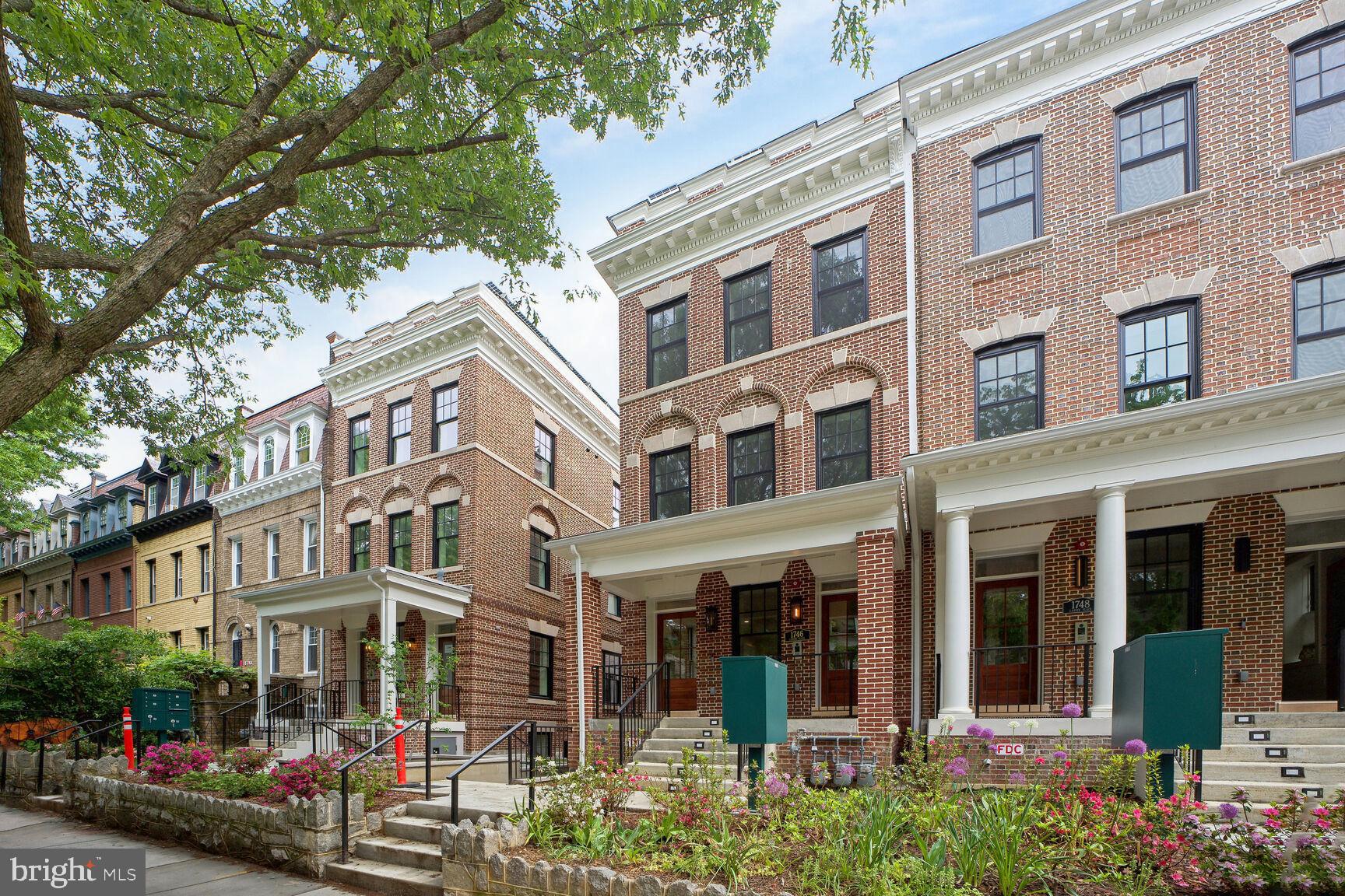 1744 Lanier Place Northwest, Unit 1 Washington, DC 20009 - Photo 1 of 39 a view of street with building and trees around