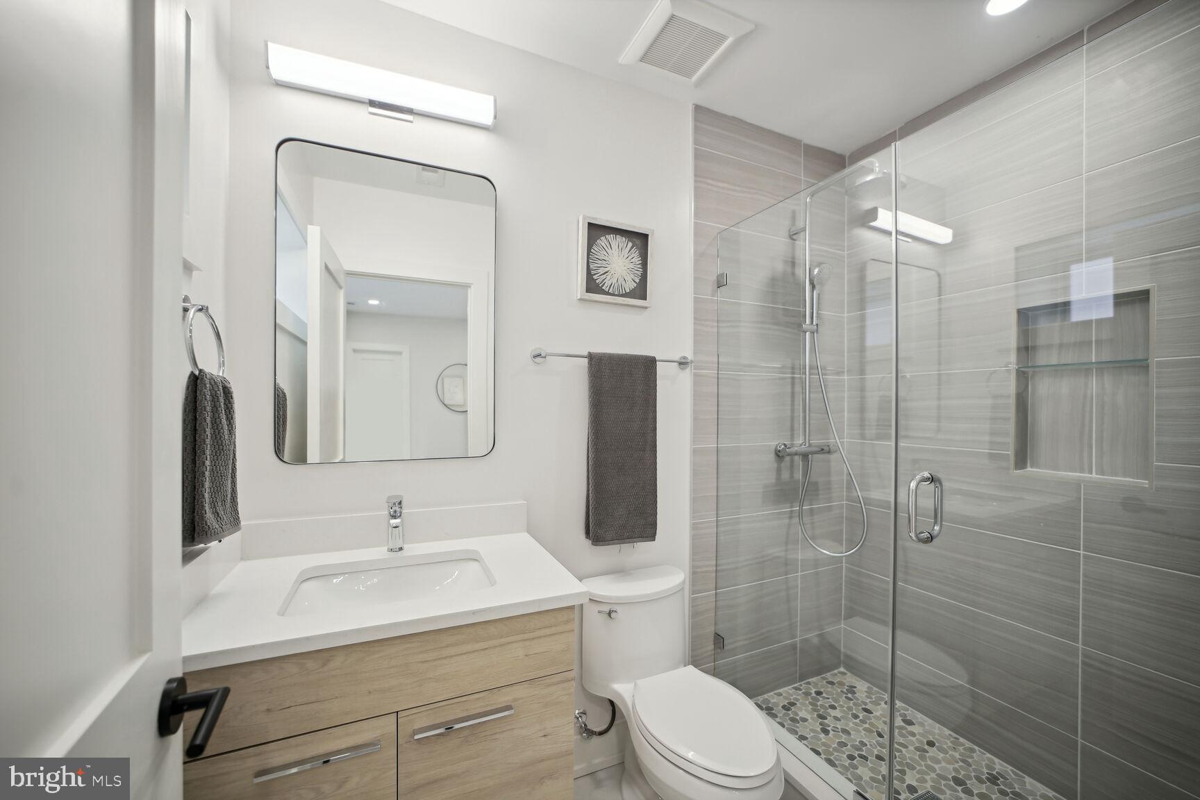 1744 Lanier Place Northwest, Unit 1 Washington, DC 20009 - Photo 15 of 39 a bathroom with a sink toilet and shower