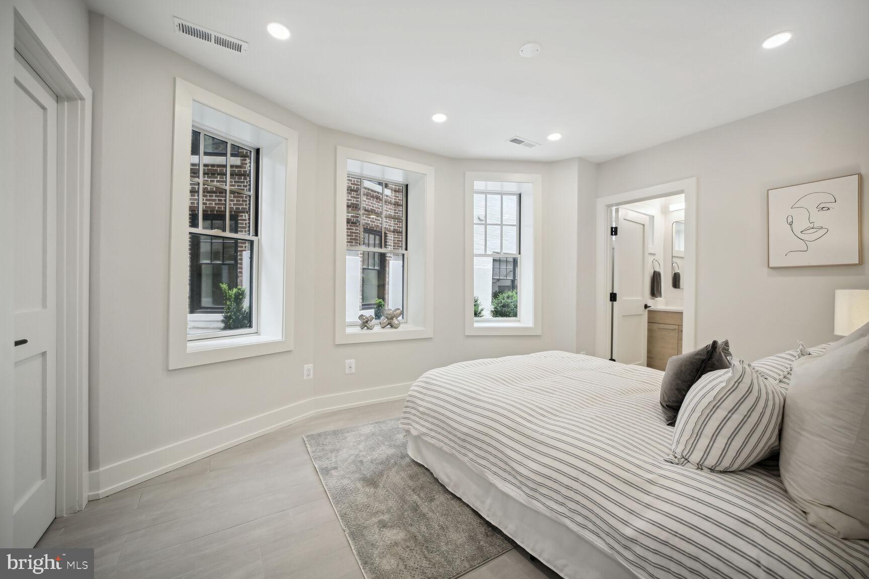 1744 Lanier Place Northwest, Unit 1 Washington, DC 20009 - Photo 19 of 39 a bedroom with a large bed and a window