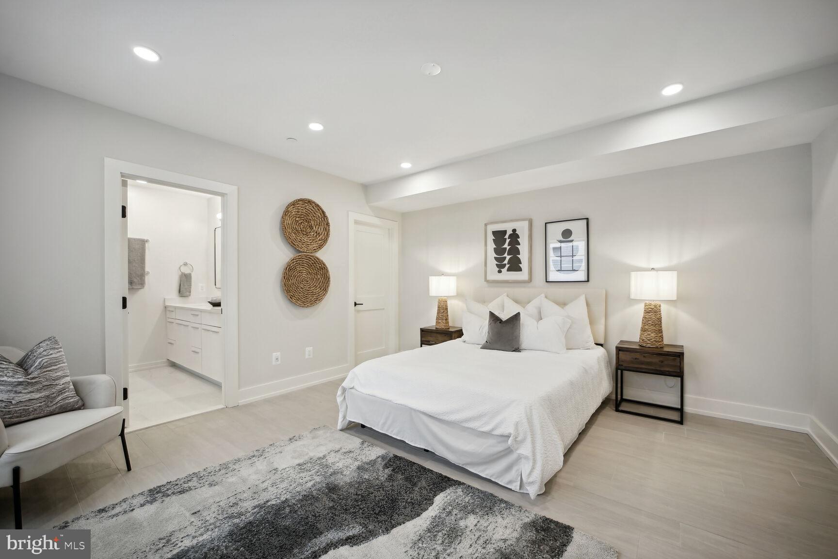 1744 Lanier Place Northwest, Unit 1 Washington, DC 20009 - Photo 21 of 39 a bedroom with a large bed and a chandelier