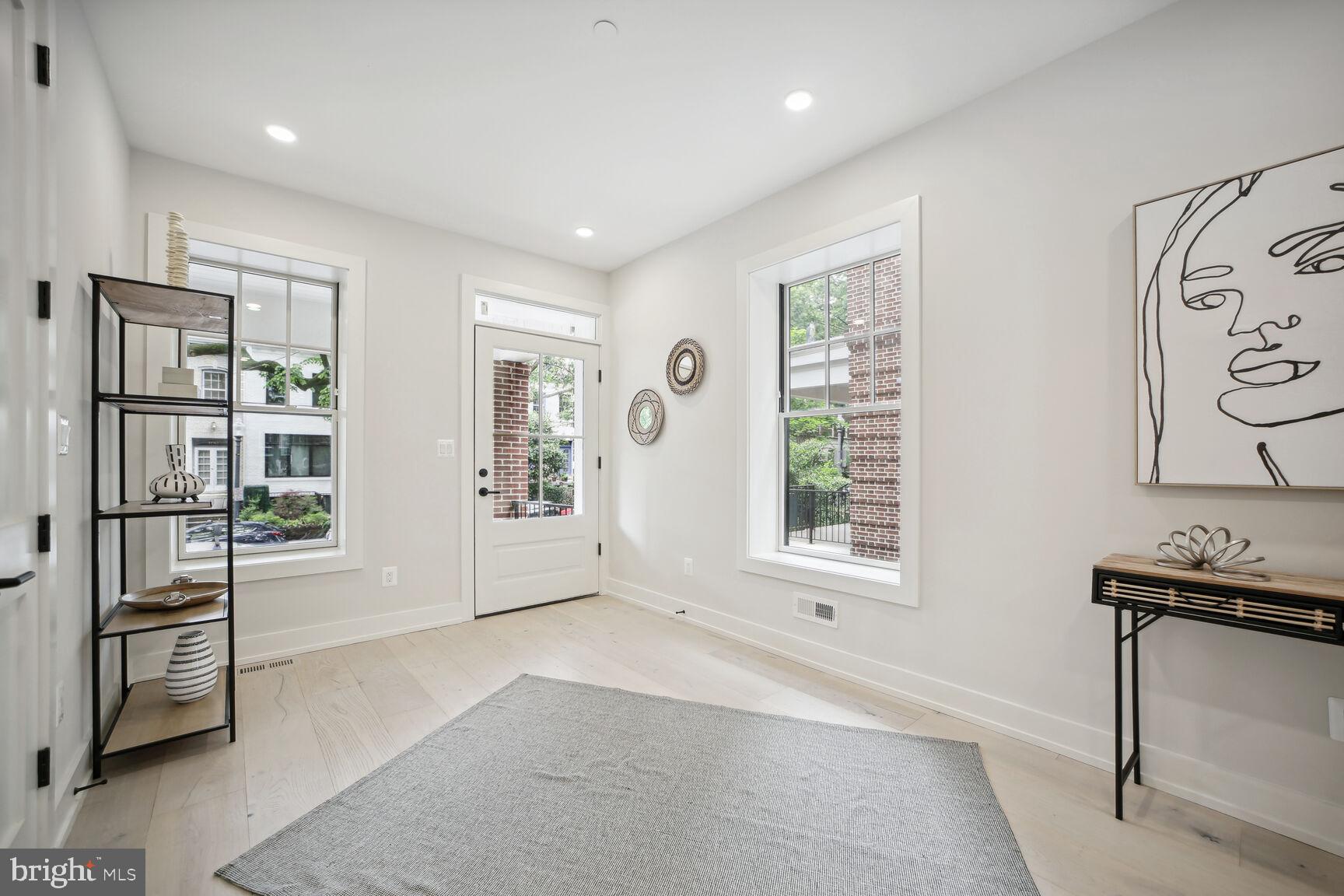 1744 Lanier Place Northwest, Unit 1 Washington, DC 20009 - Photo 23 of 39 a living room with furniture and a window