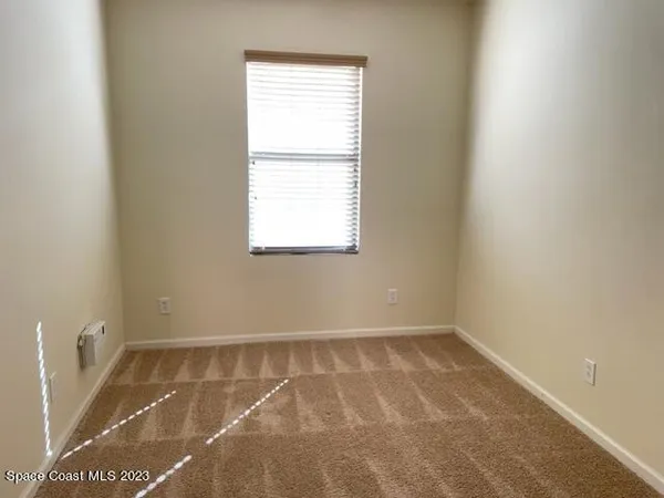 a view of a room with a window