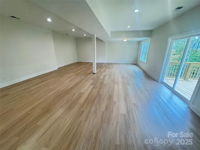a balcony with wooden floor in outdoor space