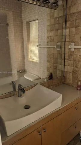 a bathroom with a sink and a bathtub