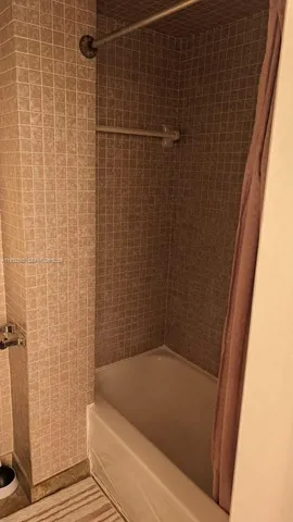 a bathroom with a small bathtub