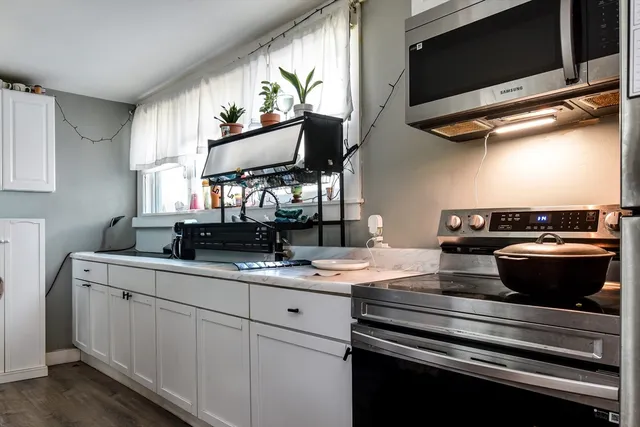 a kitchen with a stove and a microwave