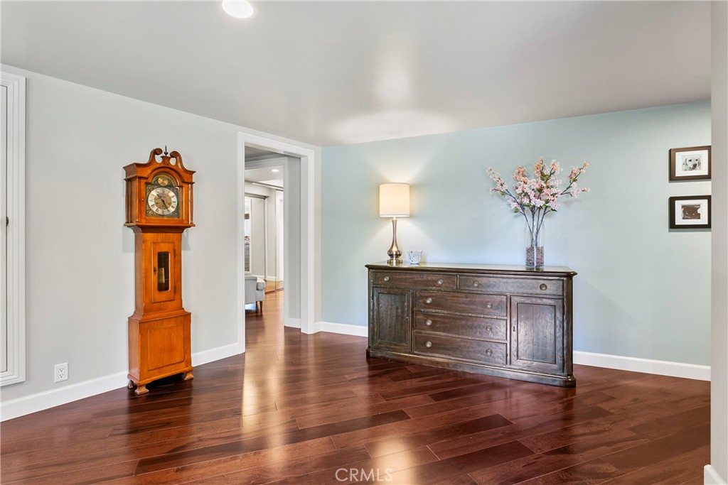 3305 Rancho Rio Bonita Road Covina, CA 91724 - Photo 11 of 71 a living room with wooden floor and a chandelier