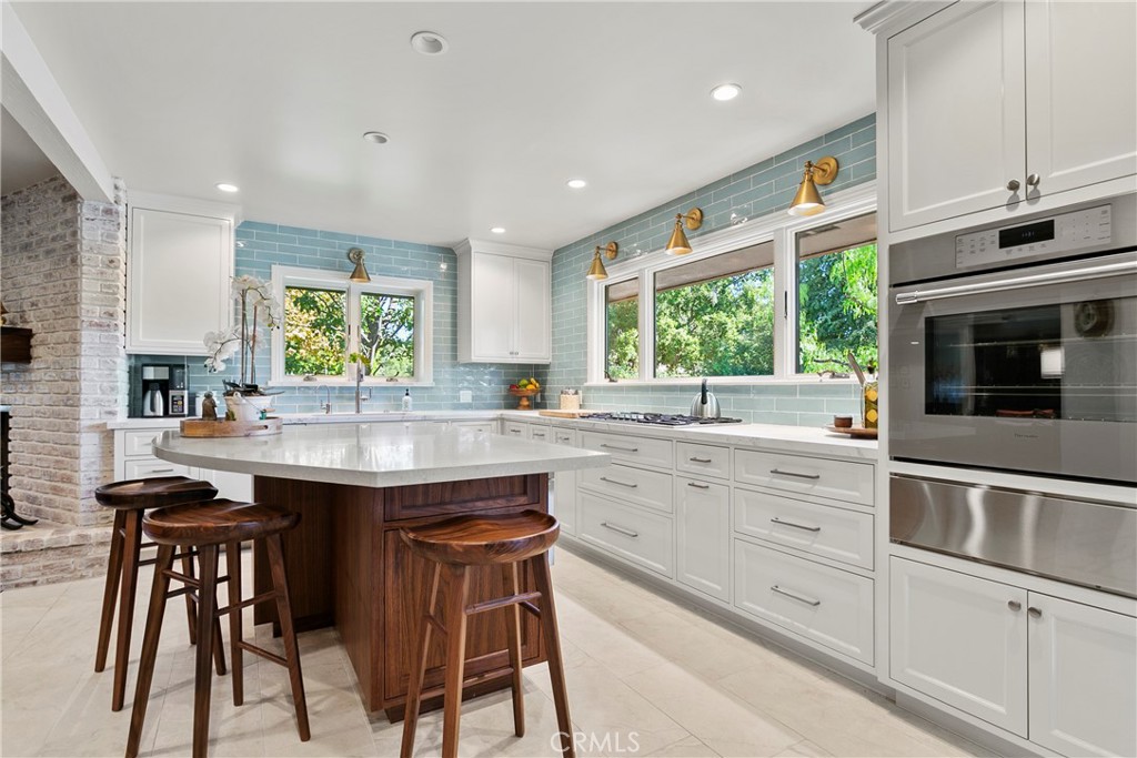 3305 Rancho Rio Bonita Road Covina, CA 91724 - Photo 16 of 71 a kitchen with granite countertop white cabinets and appliances