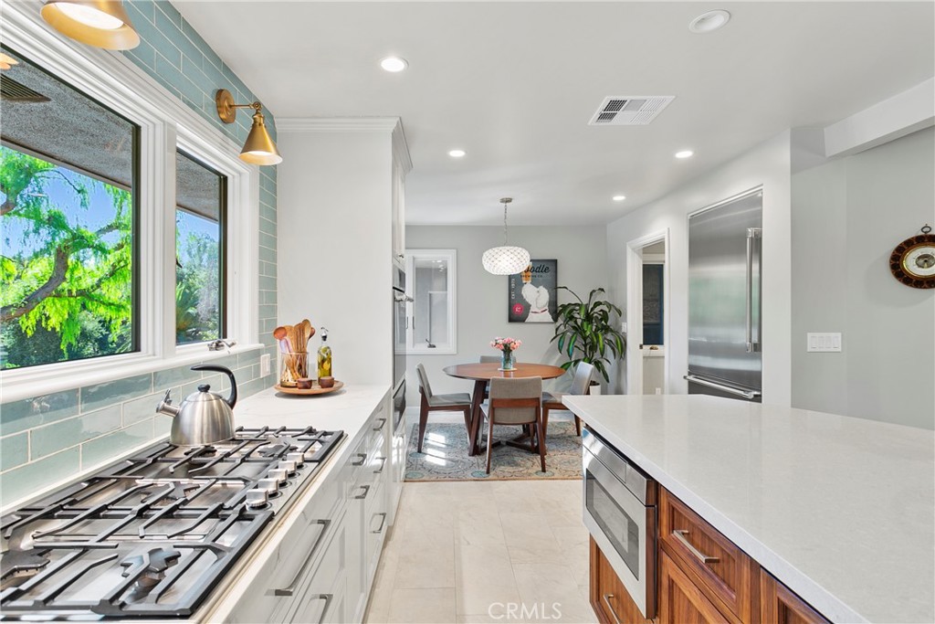 3305 Rancho Rio Bonita Road Covina, CA 91724 - Photo 18 of 71 a large kitchen with kitchen island a large window in it