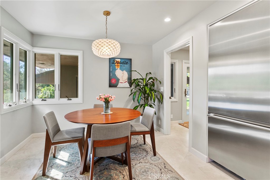 3305 Rancho Rio Bonita Road Covina, CA 91724 - Photo 19 of 71 a dining room with furniture a chandelier and window