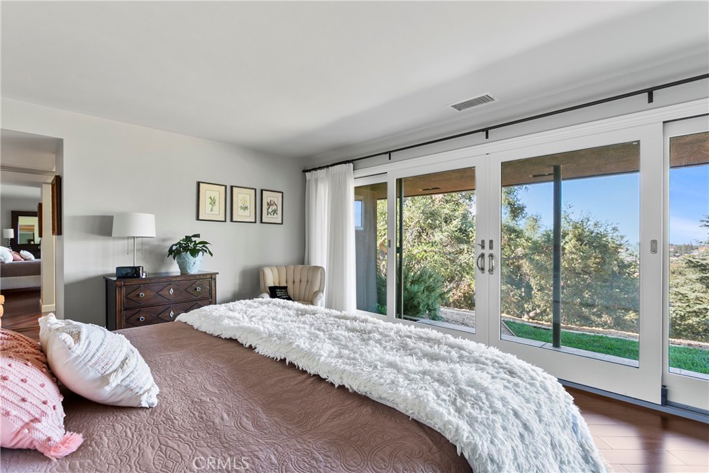 3305 Rancho Rio Bonita Road Covina, CA 91724 - Photo 29 of 71 a bedroom with a large bed and a balcony view