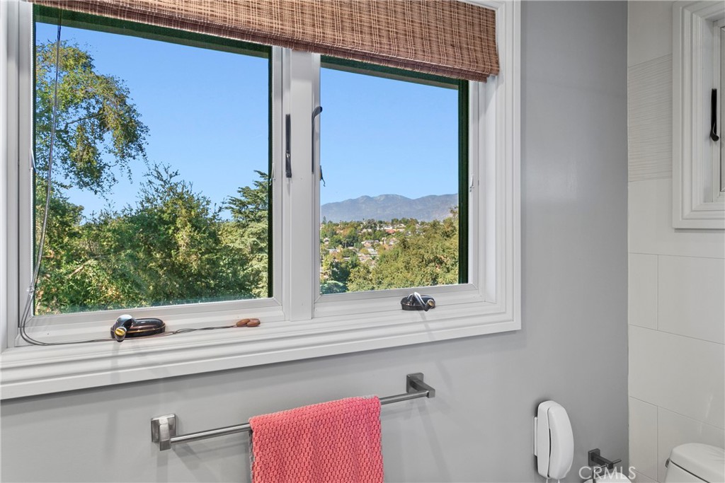 3305 Rancho Rio Bonita Road Covina, CA 91724 - Photo 33 of 71 a bathroom with a window sink and mirror