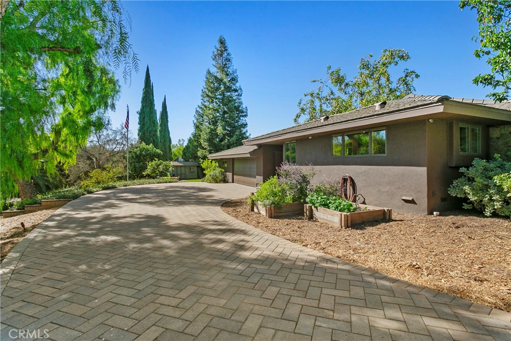 3305 Rancho Rio Bonita Road Covina, CA 91724 - Photo 39 of 71 a front view of a house with a yard and potted plants