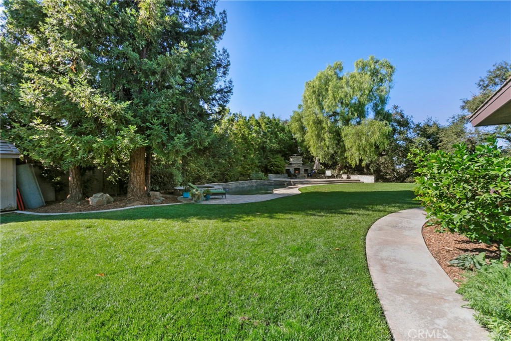 3305 Rancho Rio Bonita Road Covina, CA 91724 - Photo 45 of 71 a view of a garden with a building in the background