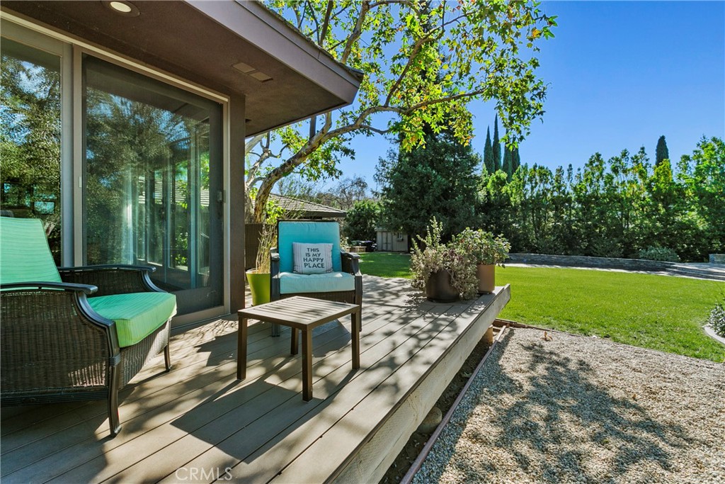 3305 Rancho Rio Bonita Road Covina, CA 91724 - Photo 52 of 71 a view of a patio with table and chairs potted plants with wooden floor and fence