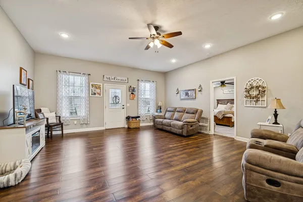 a living room with furniture and a large window