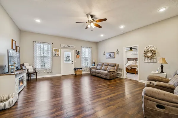 a living room with furniture and a large window