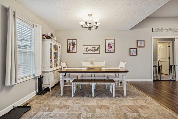 a view of a dining room with furniture