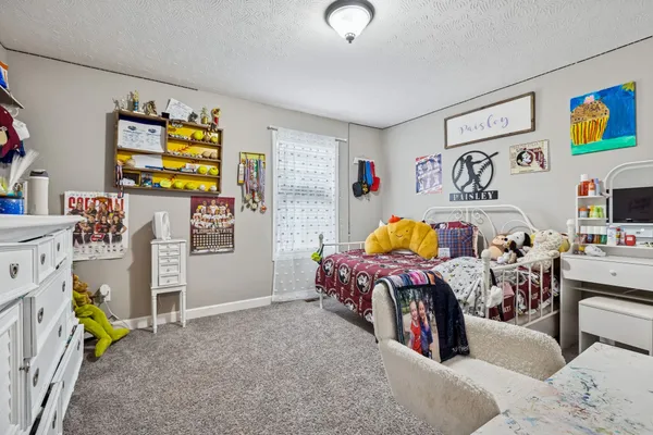 a bed room with a bed and a couch